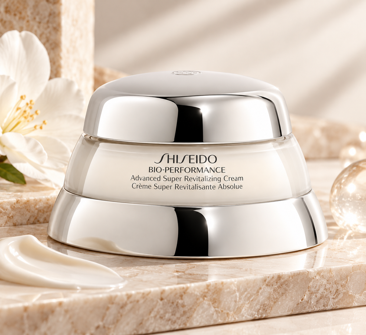 Shiseido Bio-Performance Advanced Super Revitalizing Cream 50ml displayed in an elegant skincare setting with warm neutral tones, white flowers, marble textures and a creamy product swatch, highlighting its premium revitalizing formula.
