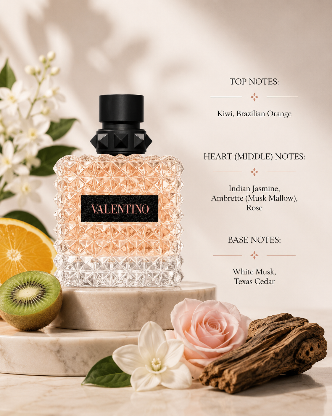 Valentino Donna Born In Roma Coral Fantasy Eau de Parfum elegantly displayed on layered beige marble pedestals in warm golden afternoon light. The composition is surrounded by freshly cut kiwi, juicy Brazilian orange slices, delicate white jasmine blossoms, soft pink roses, ambrette-inspired botanical elements, smooth cedarwood and subtle white musk accents. Soft cream fabrics, gentle botanical shadows and refined neutral tones create a luxurious Italian couture atmosphere.